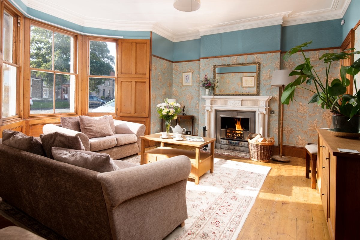 Sitting room with beautiful open fire place